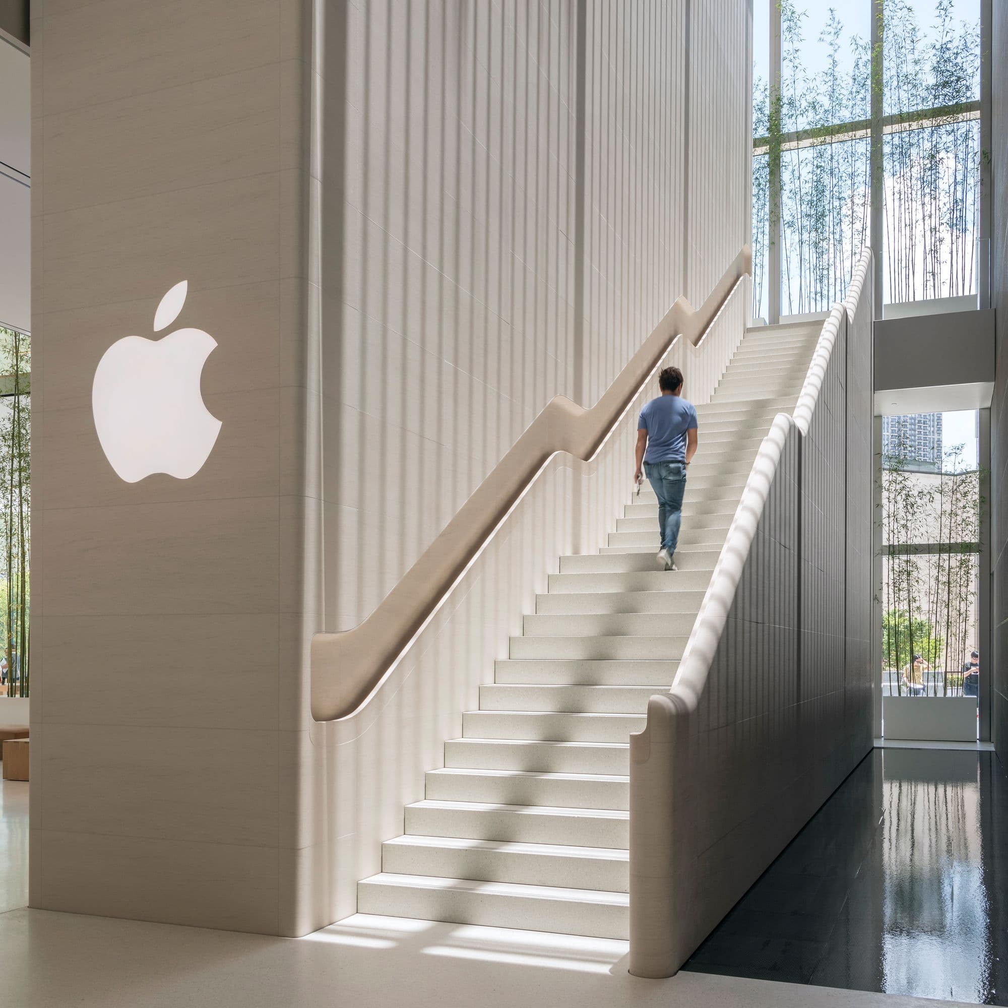 Pale stone stair and fluted wall inside Apple Orchard Road in Singapore